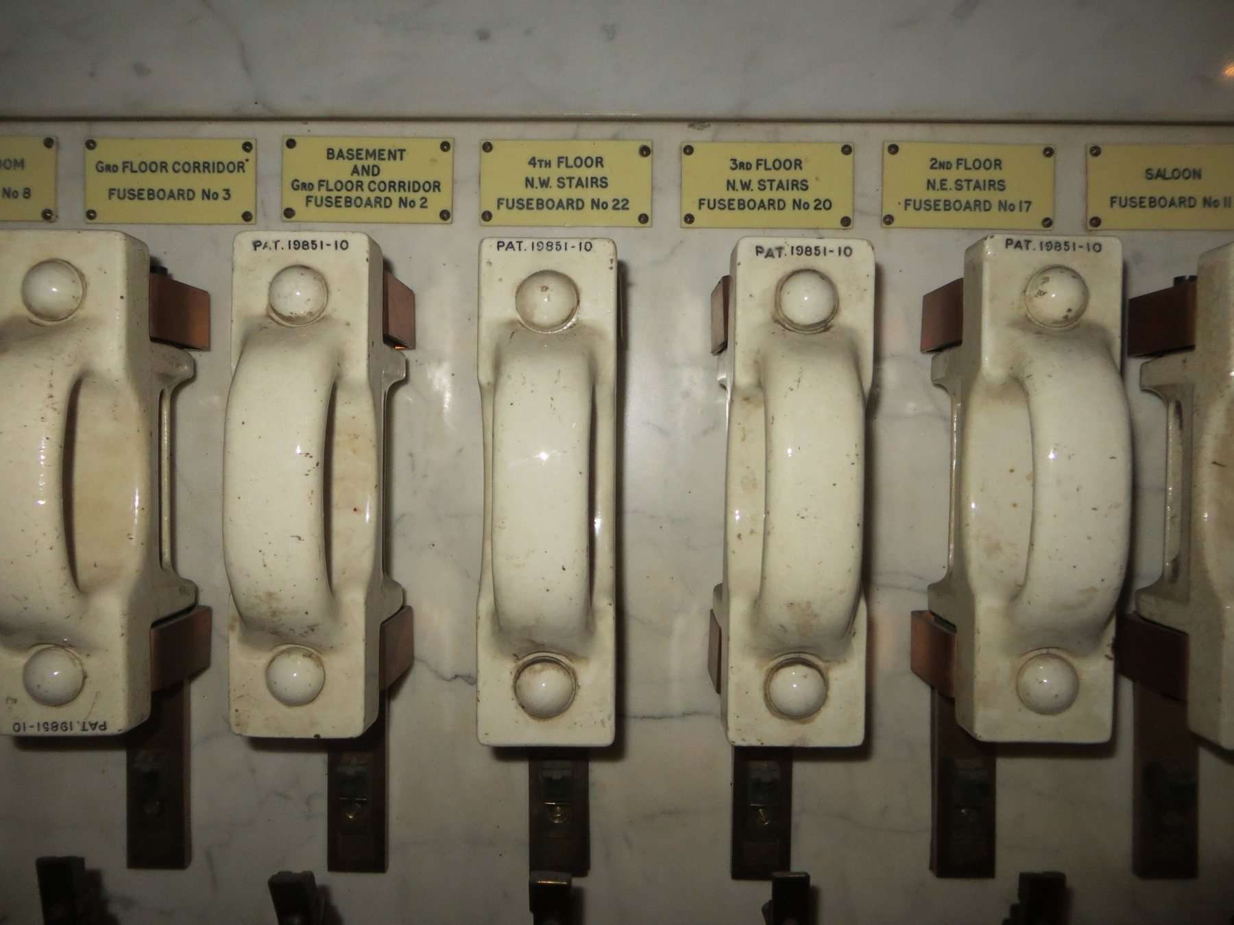 An old meter box with ceramic fuses, before an upgrade